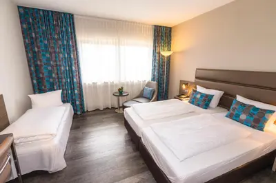 Ein Bett oder Betten in einem Zimmer der Unterkunft Hotel Scheffelhöhe