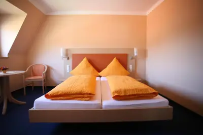 Ein Bett oder Betten in einem Zimmer der Unterkunft Hotel Linde Pfalz