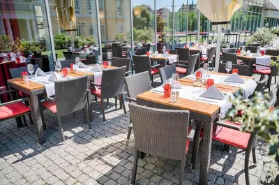 Ein Restaurant oder anderes Speiselokal in der Unterkunft Welcome Hotel Darmstadt City Center