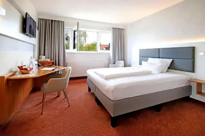 Ein Bett oder Betten in einem Zimmer der Unterkunft Tulip Inn Frankfurt Airport