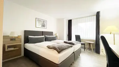 Ein Bett oder Betten in einem Zimmer der Unterkunft Hotel Freihof
