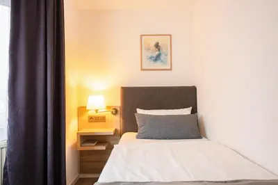Ein Bett oder Betten in einem Zimmer der Unterkunft Hotel Freihof