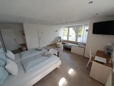 Ein Bett oder Betten in einem Zimmer der Unterkunft Pension Zweite Heimat