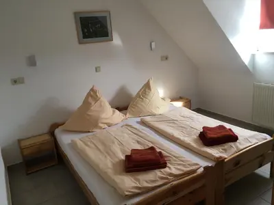 Ein Bett oder Betten in einem Zimmer der Unterkunft Lautersheimer Gutshof