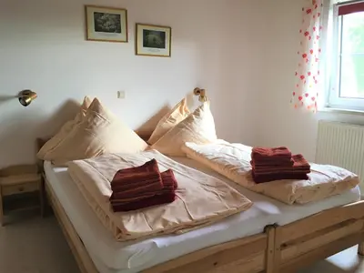 Ein Bett oder Betten in einem Zimmer der Unterkunft Lautersheimer Gutshof