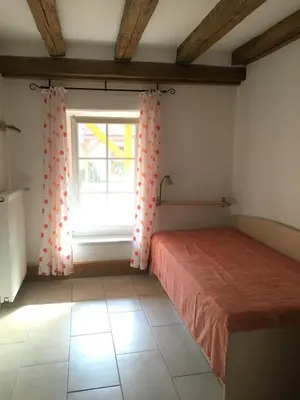 Ein Bett oder Betten in einem Zimmer der Unterkunft Lautersheimer Gutshof
