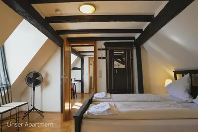 Ein Bett oder Betten in einem Zimmer der Unterkunft Das Lamm Heidelberg