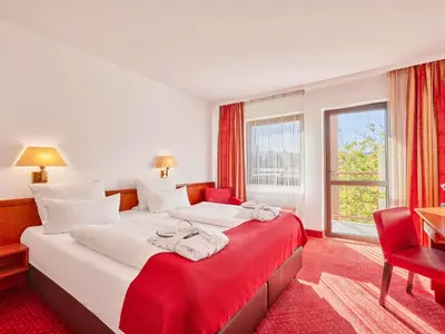 Ein Bett oder Betten in einem Zimmer der Unterkunft Mercure Hotel Bad Duerkheim An Den Salinen