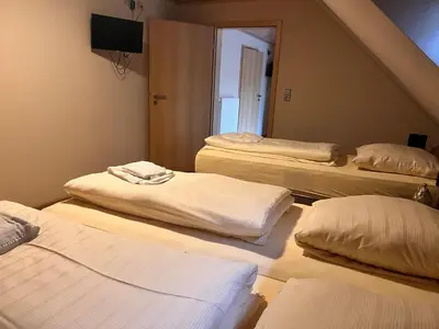 Ein Bett oder Betten in einem Zimmer der Unterkunft Hotel Restaurant Parthenon