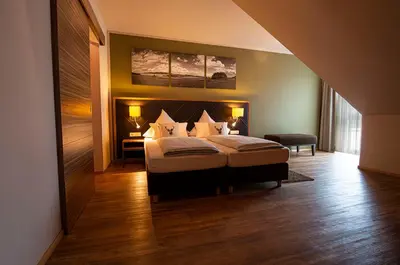 Ein Bett oder Betten in einem Zimmer der Unterkunft Müller´s Landhotel