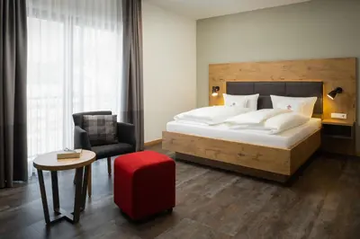 Ein Bett oder Betten in einem Zimmer der Unterkunft Ringhotel Winzerhof