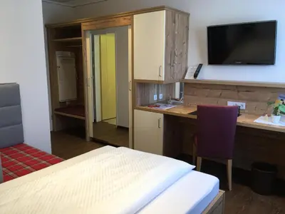 Ein Bett oder Betten in einem Zimmer der Unterkunft Ringhotel Winzerhof