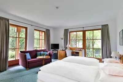 Ein Bett oder Betten in einem Zimmer der Unterkunft Hotel und Gutsgaststätte Rappenhof
