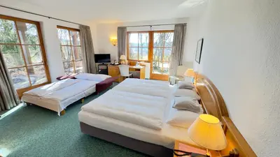 Ein Bett oder Betten in einem Zimmer der Unterkunft Hotel und Gutsgaststätte Rappenhof