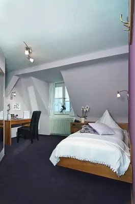 Ein Bett oder Betten in einem Zimmer der Unterkunft Gasthaus zum Ochsen