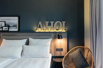 Ein Bett oder Betten in einem Zimmer der Unterkunft HARBR Hotel Ludwigsburg, a member of Radisson Individuals