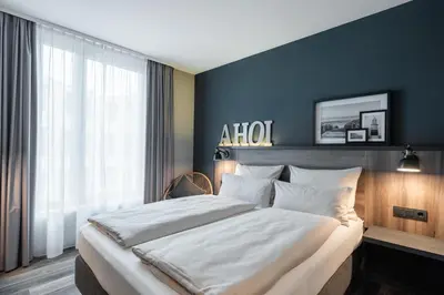 Ein Bett oder Betten in einem Zimmer der Unterkunft HARBR Hotel Ludwigsburg, a member of Radisson Individuals