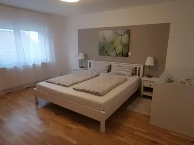 Ein Bett oder Betten in einem Zimmer der Unterkunft Ihre Ferienwohnung in 67454 Haßloch - Pfalz