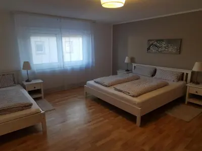 Ein Bett oder Betten in einem Zimmer der Unterkunft Ihre Ferienwohnung in 67454 Haßloch - Pfalz