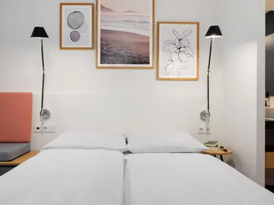 Ein Bett oder Betten in einem Zimmer der Unterkunft smartments Mannheim Hauptbahnhof