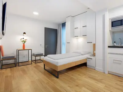 Ein Bett oder Betten in einem Zimmer der Unterkunft smartments Mannheim Hauptbahnhof