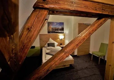 Ein Bett oder Betten in einem Zimmer der Unterkunft Kelterhotel Fröscher