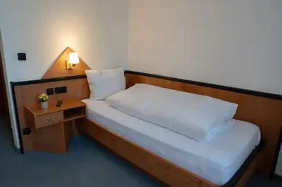 Ein Bett oder Betten in einem Zimmer der Unterkunft E&D Hotel Rodgau