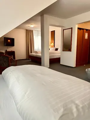 Ein Bett oder Betten in einem Zimmer der Unterkunft E&D Hotel Rodgau