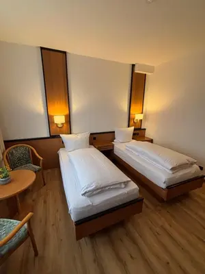 Ein Bett oder Betten in einem Zimmer der Unterkunft E&D Hotel Rodgau