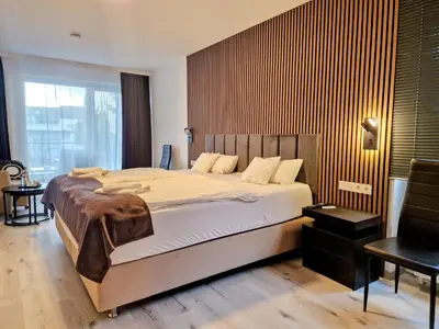Ein Bett oder Betten in einem Zimmer der Unterkunft Hotel am Kurpark