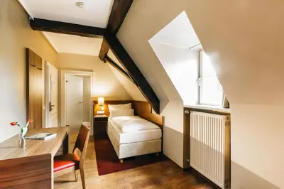 Ein Bett oder Betten in einem Zimmer der Unterkunft Amtshaus Freinsheim