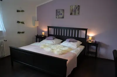 Ein Bett oder Betten in einem Zimmer der Unterkunft Wolfschlucht