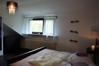 Ein Bett oder Betten in einem Zimmer der Unterkunft Wolfschlucht