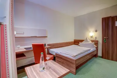 Ein Bett oder Betten in einem Zimmer der Unterkunft Wertheimer Stuben