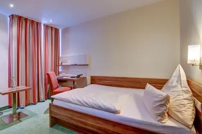 Ein Bett oder Betten in einem Zimmer der Unterkunft Wertheimer Stuben