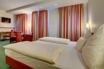 Ein Bett oder Betten in einem Zimmer der Unterkunft Wertheimer Stuben