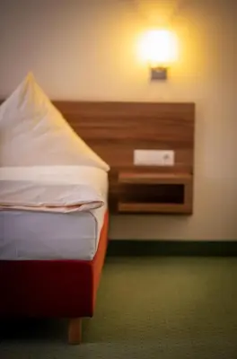 Ein Bett oder Betten in einem Zimmer der Unterkunft Wertheimer Stuben
