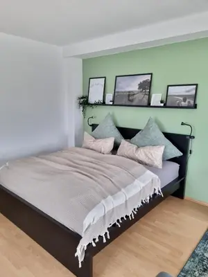 Ein Bett oder Betten in einem Zimmer der Unterkunft Ferienwohnung Appartement Bad Bergzabern mit Schwimmbad und Sauna