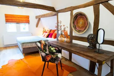 Ein Bett oder Betten in einem Zimmer der Unterkunft Adlerlodge - Ferienhaus