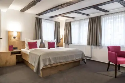 Ein Bett oder Betten in einem Zimmer der Unterkunft Hotel & Restaurant Lamm