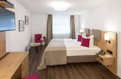 Ein Bett oder Betten in einem Zimmer der Unterkunft Hotel & Restaurant Lamm