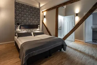 Ein Bett oder Betten in einem Zimmer der Unterkunft Hotel zur Krone
