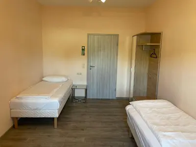 Ein Bett oder Betten in einem Zimmer der Unterkunft Relax Hotel-Ludwigshafen