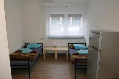 Ein Bett oder Betten in einem Zimmer der Unterkunft Zum Hexenhäusle