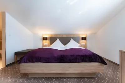 Ein Bett oder Betten in einem Zimmer der Unterkunft Birkenfelder Hof