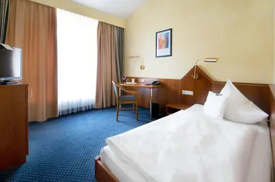 Ein Bett oder Betten in einem Zimmer der Unterkunft Birkenfelder Hof