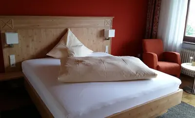 Ein Bett oder Betten in einem Zimmer der Unterkunft Hotel & Restaurant Krone