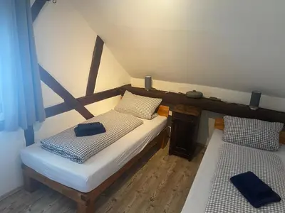 Ein Bett oder Betten in einem Zimmer der Unterkunft Ferienwohnung Obergasse