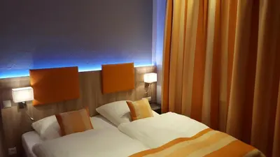 Ein Bett oder Betten in einem Zimmer der Unterkunft Hotel Trutzpfaff