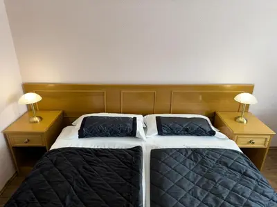 Ein Bett oder Betten in einem Zimmer der Unterkunft Hotel DenRiKo